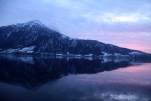 The Rigi from Walchwil at sunset, pink and lavender reflections across the lake